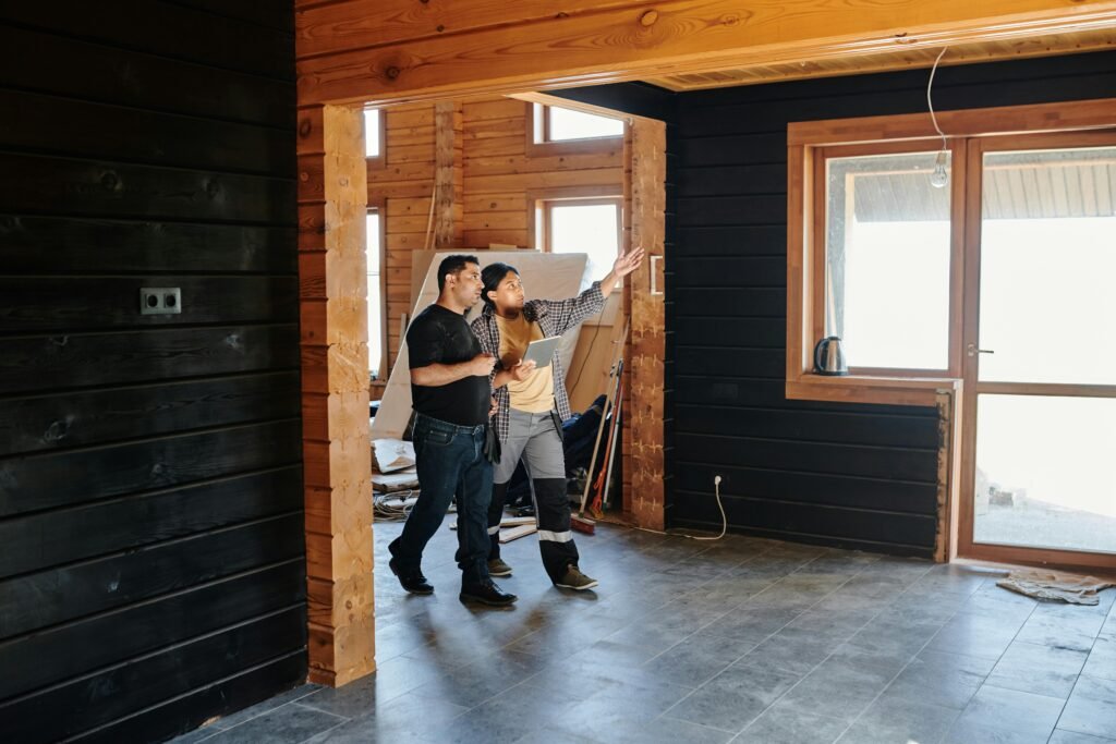 Experienced office renovation contractor reviewing blueprints on-site