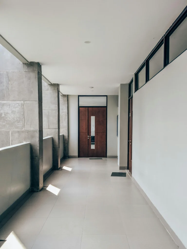 An expert designer planning a high-end interior renovation Dubai project with a client